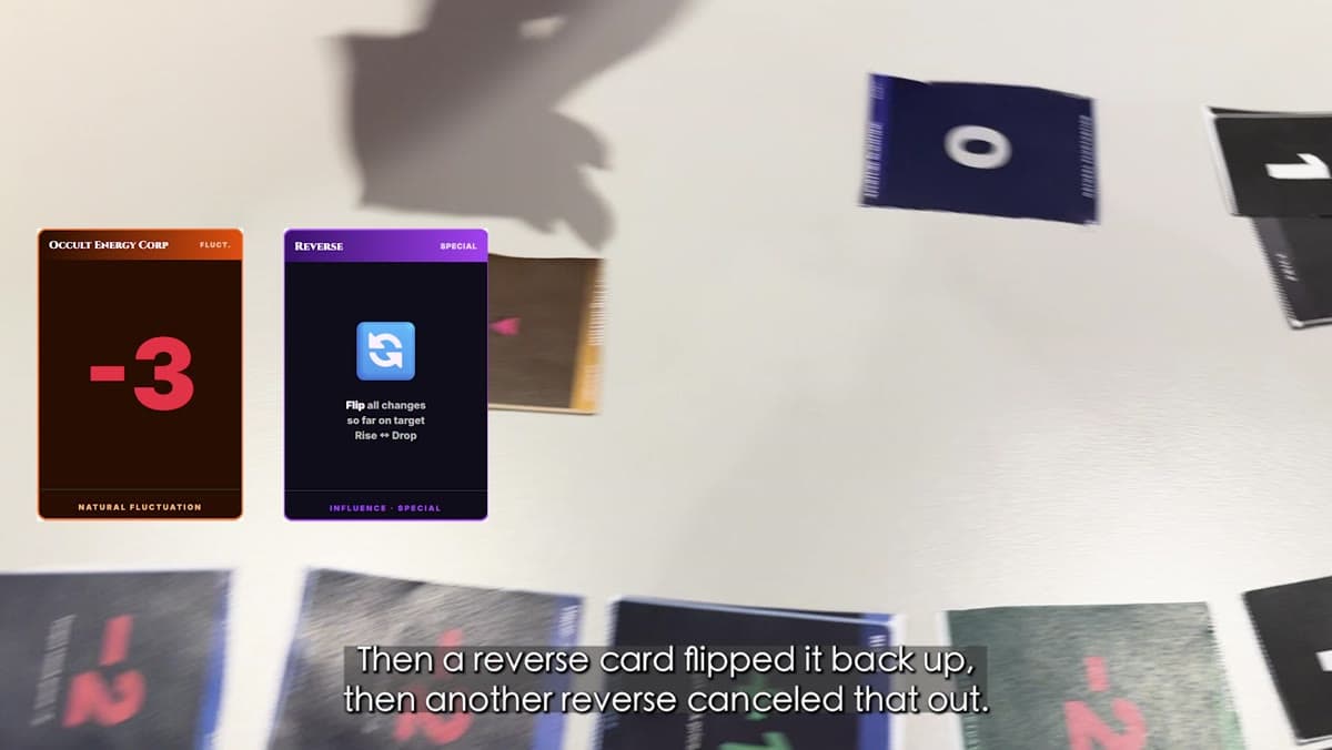 Physical cards being revealed during a settlement, including a negative fluctuation and a Reverse card